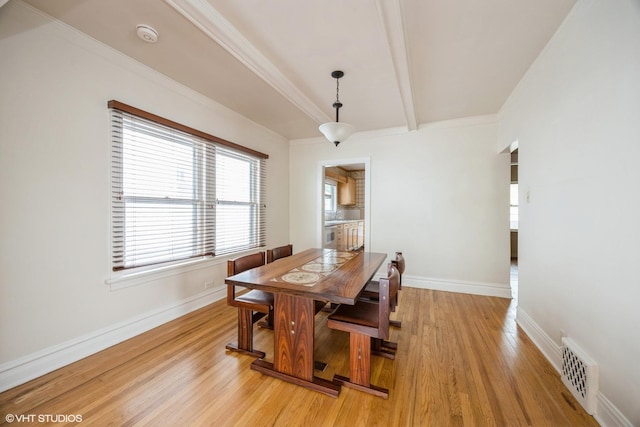 533 Clarence Ave, Oak Park, IL 60304 - dining area featuring light wood finished floors, baseboards, and beam ceiling