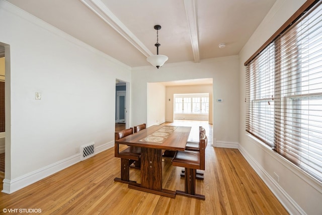 533 Clarence Ave, Oak Park, IL 60304 - dining space with light wood-style floors, beam ceiling, and baseboards