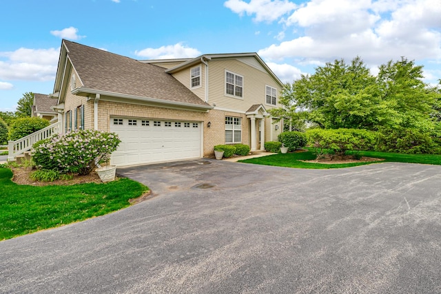10 Millbrook Ct, Algonquin, IL 60102 - view of front facade featuring driveway, roof with shingles, an attached garage, and a front lawn