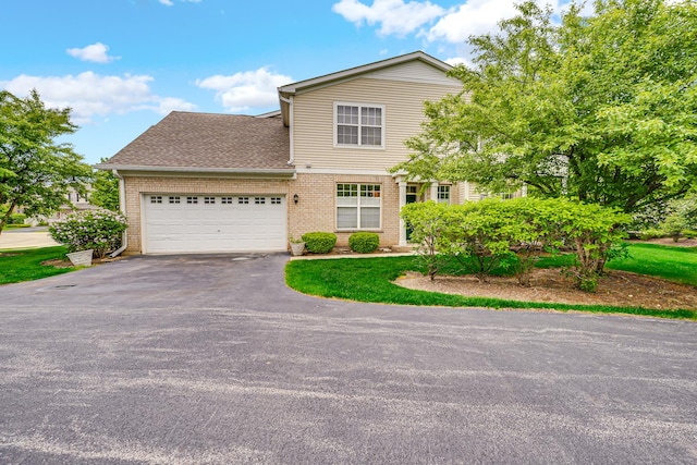 10 Millbrook Ct, Algonquin, IL 60102 - traditional-style house featuring asphalt driveway, brick siding, a garage, and roof with shingles