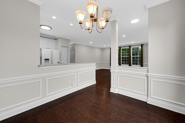 10 Millbrook Ct, Algonquin, IL 60102 - unfurnished dining area with a decorative wall, crown molding, a chandelier, dark wood finished floors, and a wainscoted wall