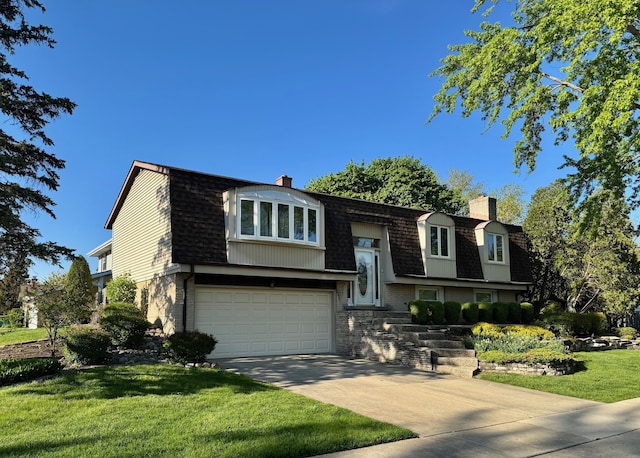 view of front of home with a chimney, concrete driveway, roof with shingles, and a front yard