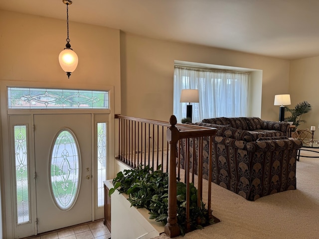 entryway featuring healthy amount of natural light and light tile patterned flooring