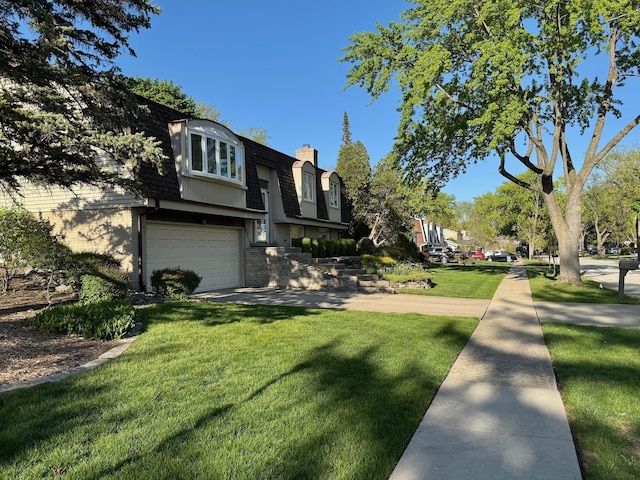 view of side of home featuring mansard roof, a garage, a lawn, roof with shingles, and a chimney