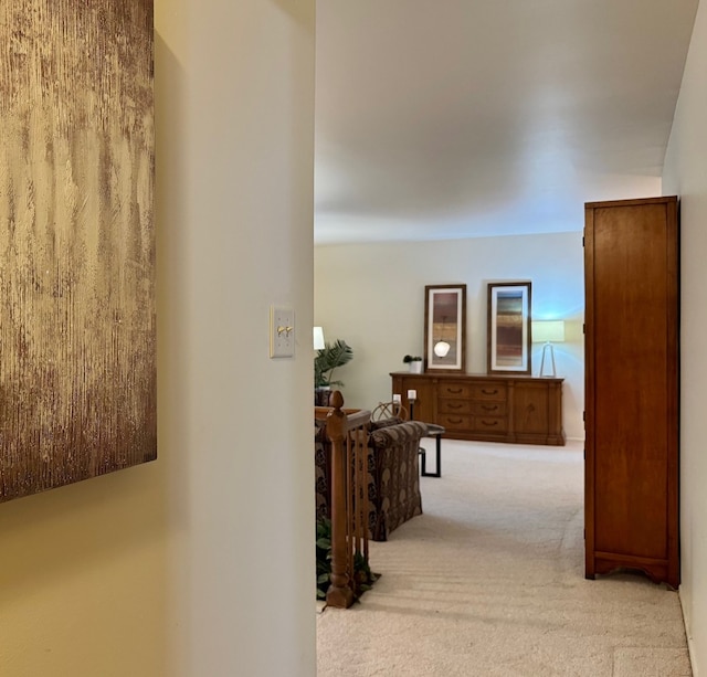 hallway with carpet flooring
