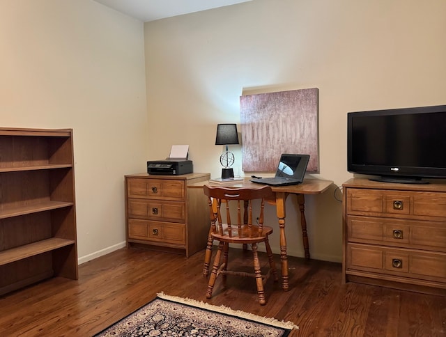 office space featuring wood finished floors and baseboards