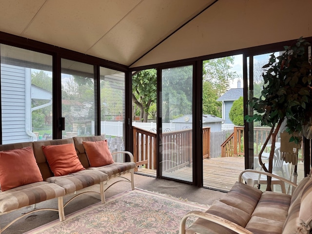 sunroom featuring an outdoor hangout area and vaulted ceiling