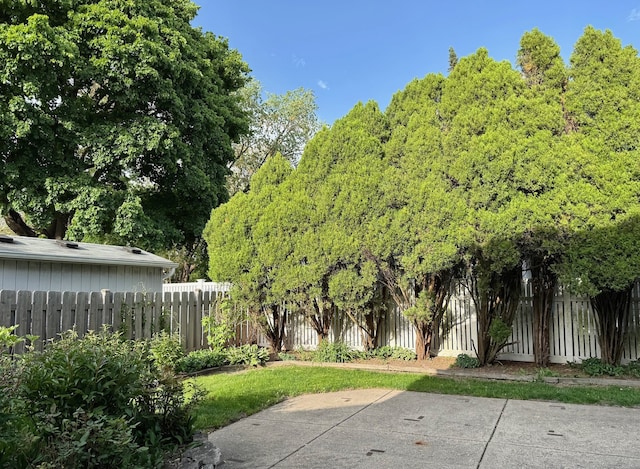 fenced backyard featuring a patio area