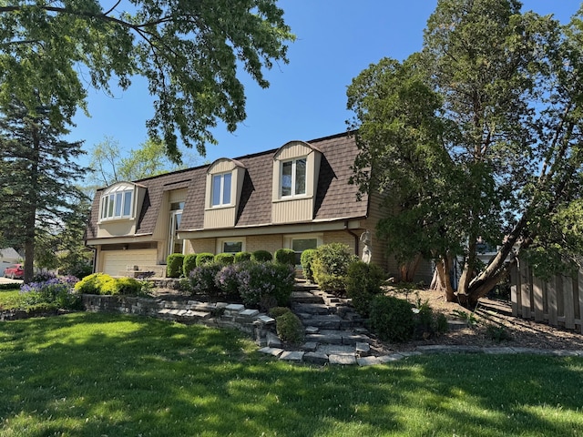 416 Trinity Ct, Buffalo Grove, IL 60089 - view of front property with mansard roof, a front lawn, an attached garage, brick siding, and a shingled roof