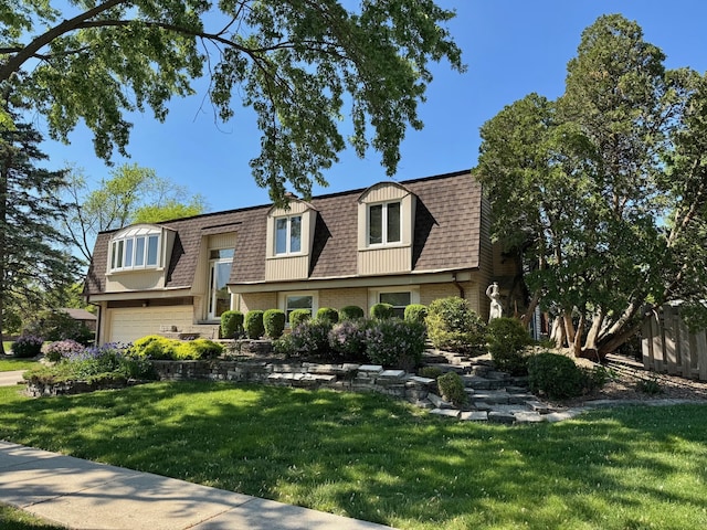 416 Trinity Ct, Buffalo Grove, IL 60089 - view of property with mansard roof, an attached garage, a shingled roof, a front lawn, and brick siding