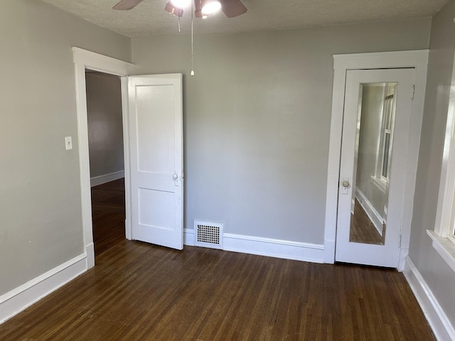 1406 W Locust St, Bloomington, IL 61701 - spare room featuring ceiling fan, wood finished floors, and baseboards