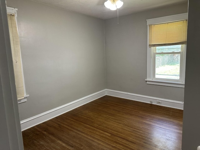1406 W Locust St, Bloomington, IL 61701 - spare room with wood finished floors, baseboards, and ceiling fan