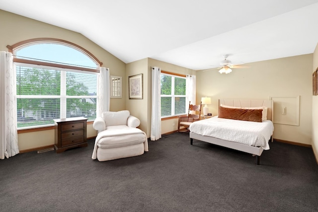bedroom featuring lofted ceiling, dark carpet, ceiling fan, and baseboards