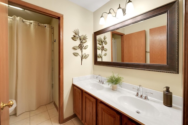 full bathroom with tile patterned floors and double vanity