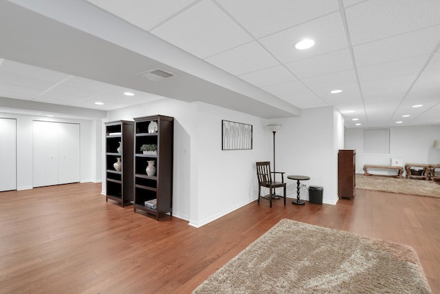 sitting room with wood finished floors, baseboards, and recessed lighting