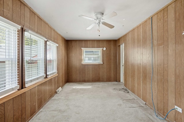 1918 W 108th Pl, Chicago, IL 60643 - unfurnished room with carpet flooring, wood walls, and a ceiling fan