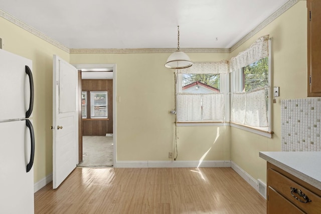 1918 W 108th Pl, Chicago, IL 60643 - unfurnished dining area with light wood finished floors, baseboards, and crown molding