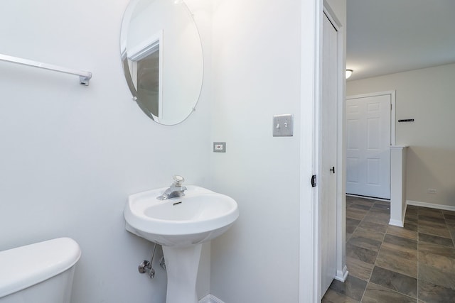 21536 Vesper St, Crest Hill, IL 60403 - bathroom with toilet, baseboards, and stone finish flooring