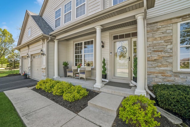 718 Northgate Dr, Sycamore, IL 60178 - view of exterior entry featuring covered porch and stone siding