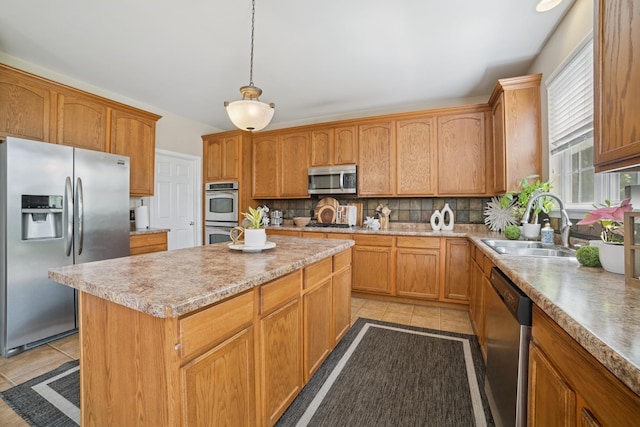 718 Northgate Dr, Sycamore, IL 60178 - kitchen with appliances with stainless steel finishes, light tile patterned flooring, a center island, decorative backsplash, and a sink