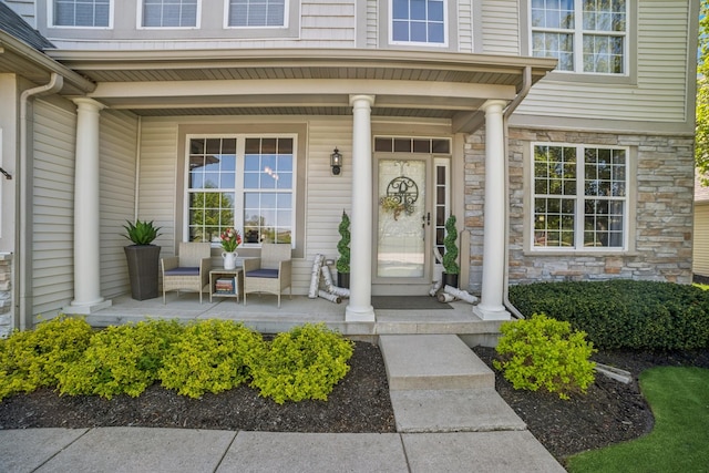 718 Northgate Dr, Sycamore, IL 60178 - entrance to property with a porch and stone siding