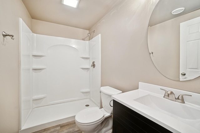 718 Northgate Dr, Sycamore, IL 60178 - full bathroom featuring toilet, a shower, vanity, and wood finished floors