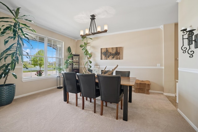 718 Northgate Dr, Sycamore, IL 60178 - carpeted dining room with a chandelier, crown molding, and baseboards