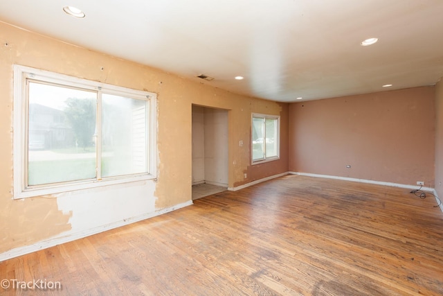910 E Krage Dr, Addison, IL 60101 - spare room with wood finished floors and recessed lighting