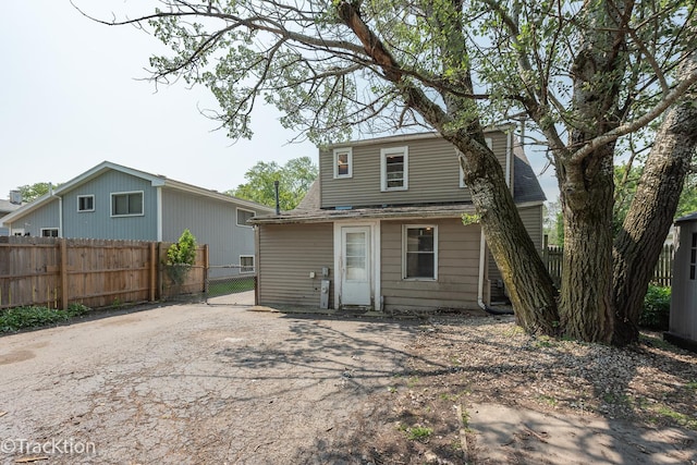 910 E Krage Dr, Addison, IL 60101 - rear view of house featuring roof with shingles