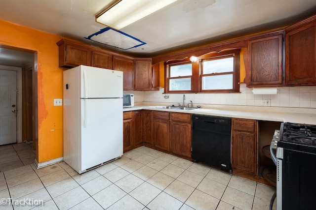 910 E Krage Dr, Addison, IL 60101 - kitchen with white appliances, tasteful backsplash, light countertops, light tile patterned flooring, and brown cabinets