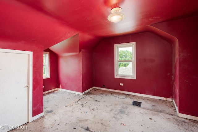 910 E Krage Dr, Addison, IL 60101 - additional living space featuring baseboards and vaulted ceiling