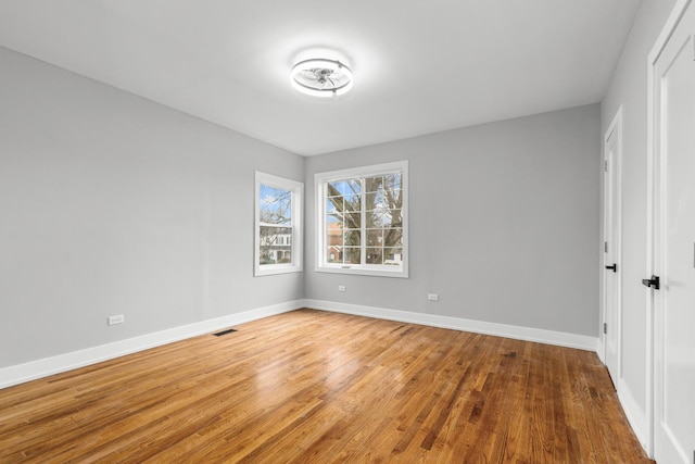 12725 S Wallace St, Chicago, IL 60628 - empty room featuring wood finished floors and baseboards