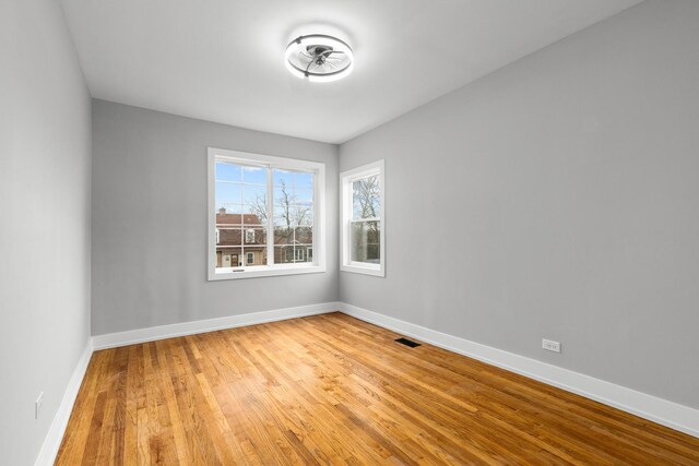 12725 S Wallace St, Chicago, IL 60628 - spare room featuring light wood-style floors and baseboards