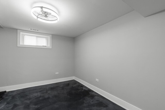 12725 S Wallace St, Chicago, IL 60628 - unfurnished room with unfinished concrete flooring and baseboards