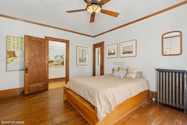 bedroom featuring radiator, hardwood / wood-style floors, ornamental molding, baseboards, and ceiling fan