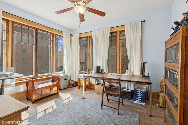 home office featuring a ceiling fan and wood finished floors