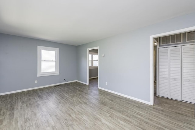 1705 Lyons Ct, Waukegan, IL 60085 - spare room with wood finished floors and baseboards