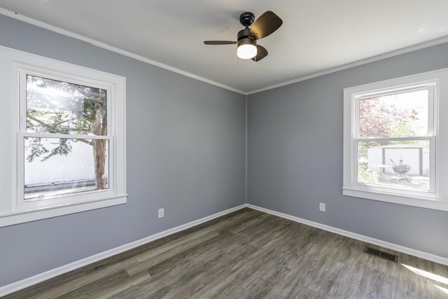 1705 Lyons Ct, Waukegan, IL 60085 - unfurnished room featuring healthy amount of natural light, wood finished floors, baseboards, ornamental molding, and a ceiling fan
