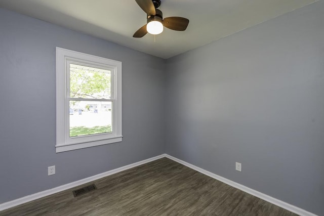 1705 Lyons Ct, Waukegan, IL 60085 - empty room featuring baseboards, dark wood-type flooring, and a ceiling fan