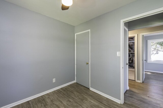 1705 Lyons Ct, Waukegan, IL 60085 - unfurnished room featuring wood finished floors, a ceiling fan, and baseboards