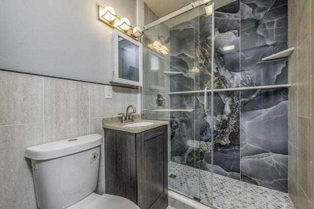 1705 Lyons Ct, Waukegan, IL 60085 - bathroom featuring toilet, a shower stall, vanity, and tile walls