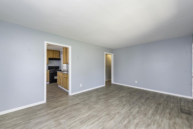 1705 Lyons Ct, Waukegan, IL 60085 - unfurnished room with light wood-type flooring and baseboards