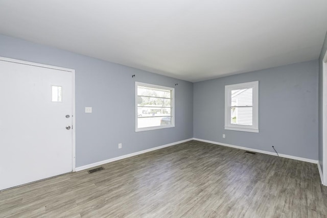 1705 Lyons Ct, Waukegan, IL 60085 - unfurnished room featuring wood finished floors and baseboards