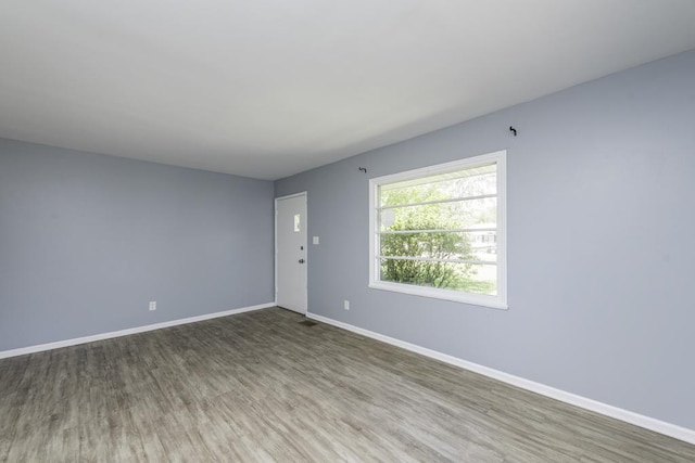 1705 Lyons Ct, Waukegan, IL 60085 - spare room featuring wood finished floors and baseboards