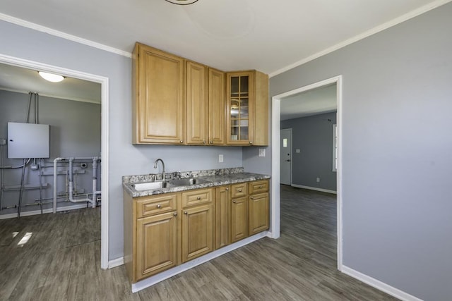 1705 Lyons Ct, Waukegan, IL 60085 - kitchen featuring dark wood finished floors, a sink, baseboards, crown molding, and glass insert cabinets