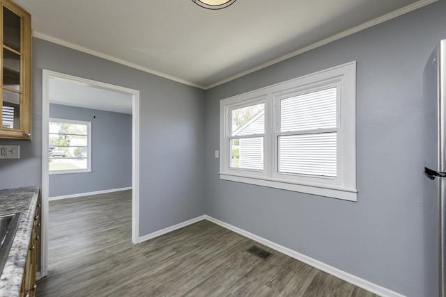 1705 Lyons Ct, Waukegan, IL 60085 - empty room with dark wood-style floors, baseboards, and ornamental molding