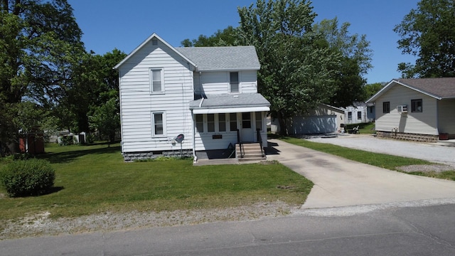 218 W Fleming St, Watseka, IL 60970 - view of front of property featuring a shingled roof, a front lawn, and entry steps