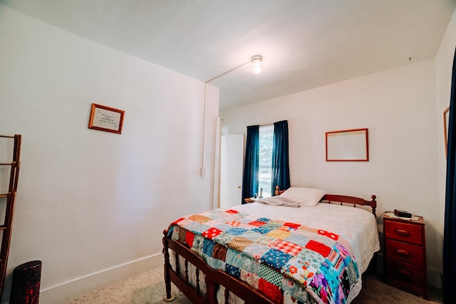 218 W Fleming St, Watseka, IL 60970 - carpeted bedroom featuring baseboards