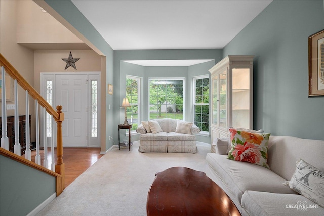 S970 Newton Sq, Geneva, IL 60134 - living room featuring carpet floors, stairway, and baseboards