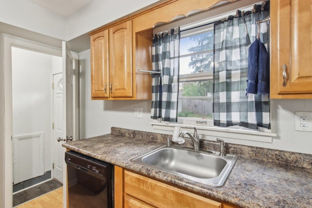 35790 N Wilson Rd, Ingleside, IL 60041 - kitchen featuring black dishwasher, a sink, dark countertops, and wood finished floors
